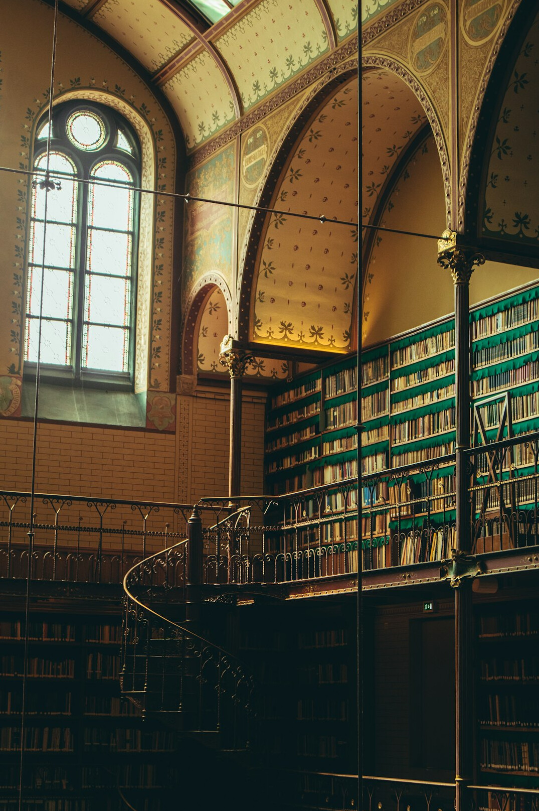 Interior of an old library with tall wooden bookshelves