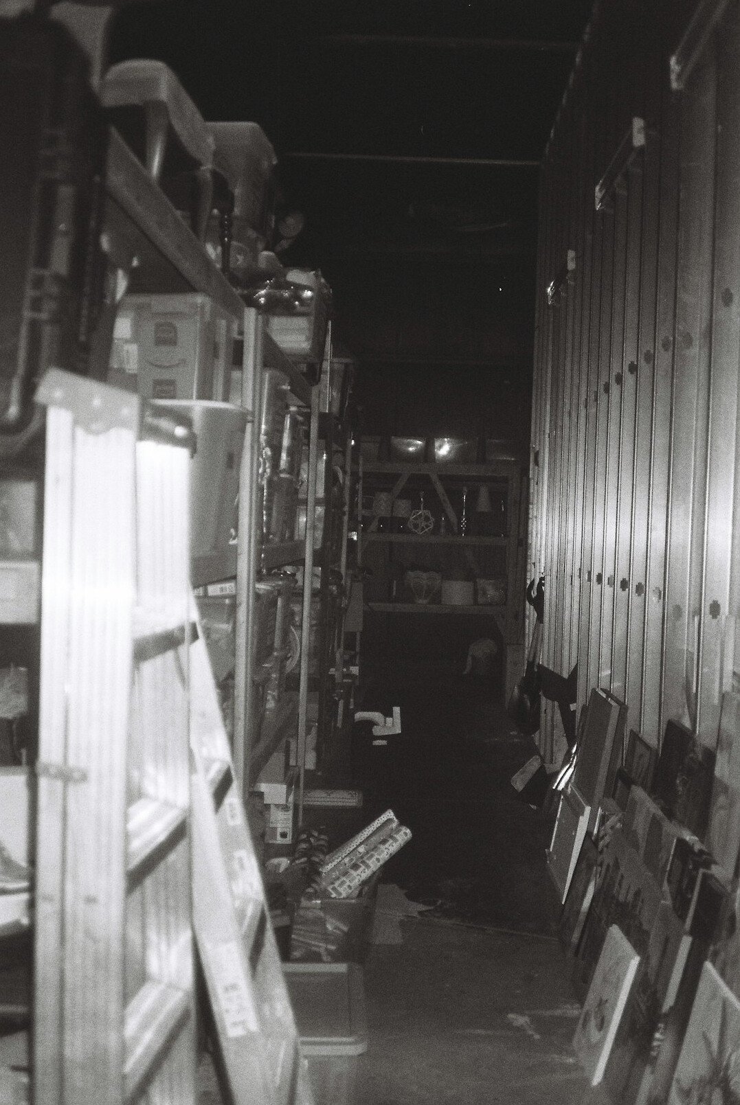 security guard checking aisles at night