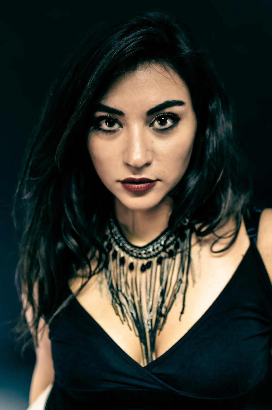 Studio portrait of a Hispanic woman in her 40s, professional editor