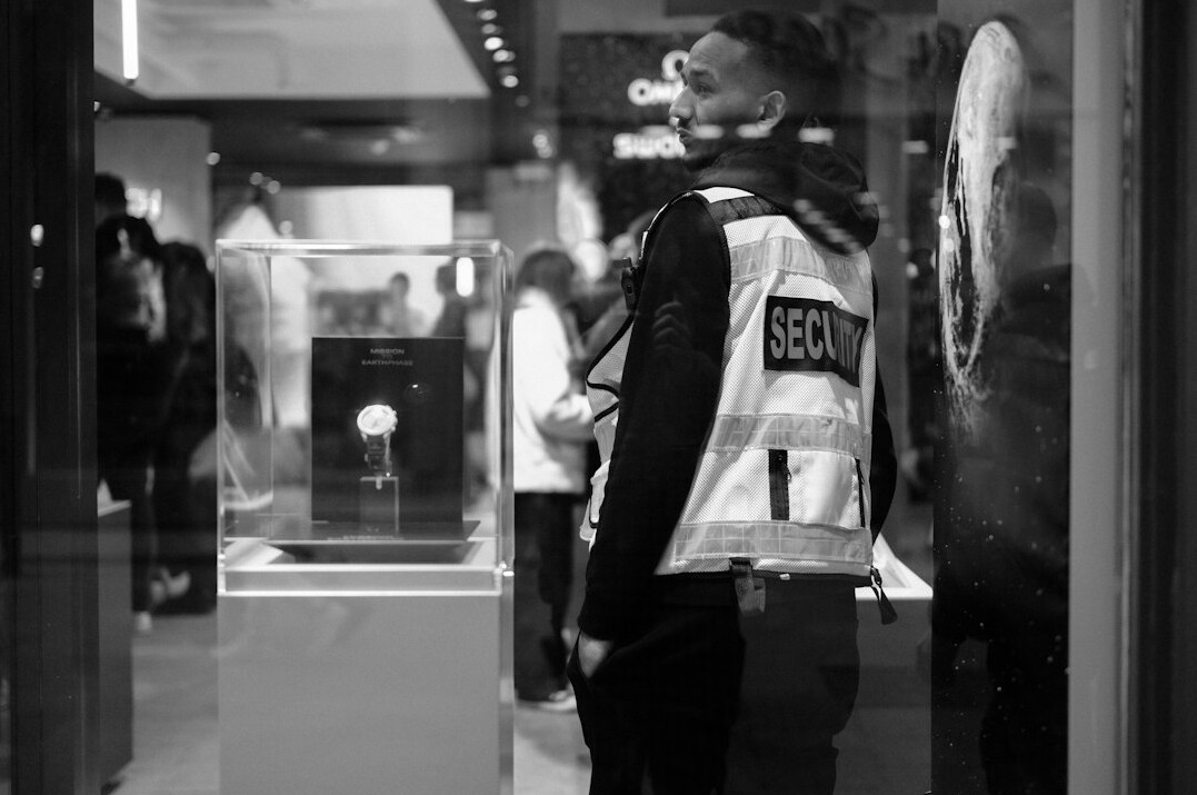 store detective watching customer